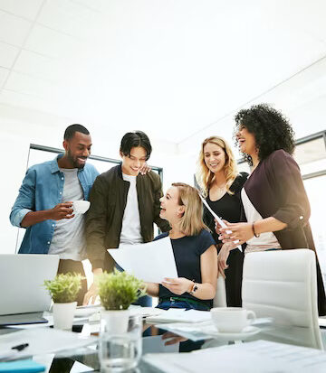 diverse-cheerful-successful-meeting-with-business-people-working-planning-brainstorming-ideas-strategy-project-report-paper-work-busy-colleagues-showing-good-teamwork-copy-space_590464-78918